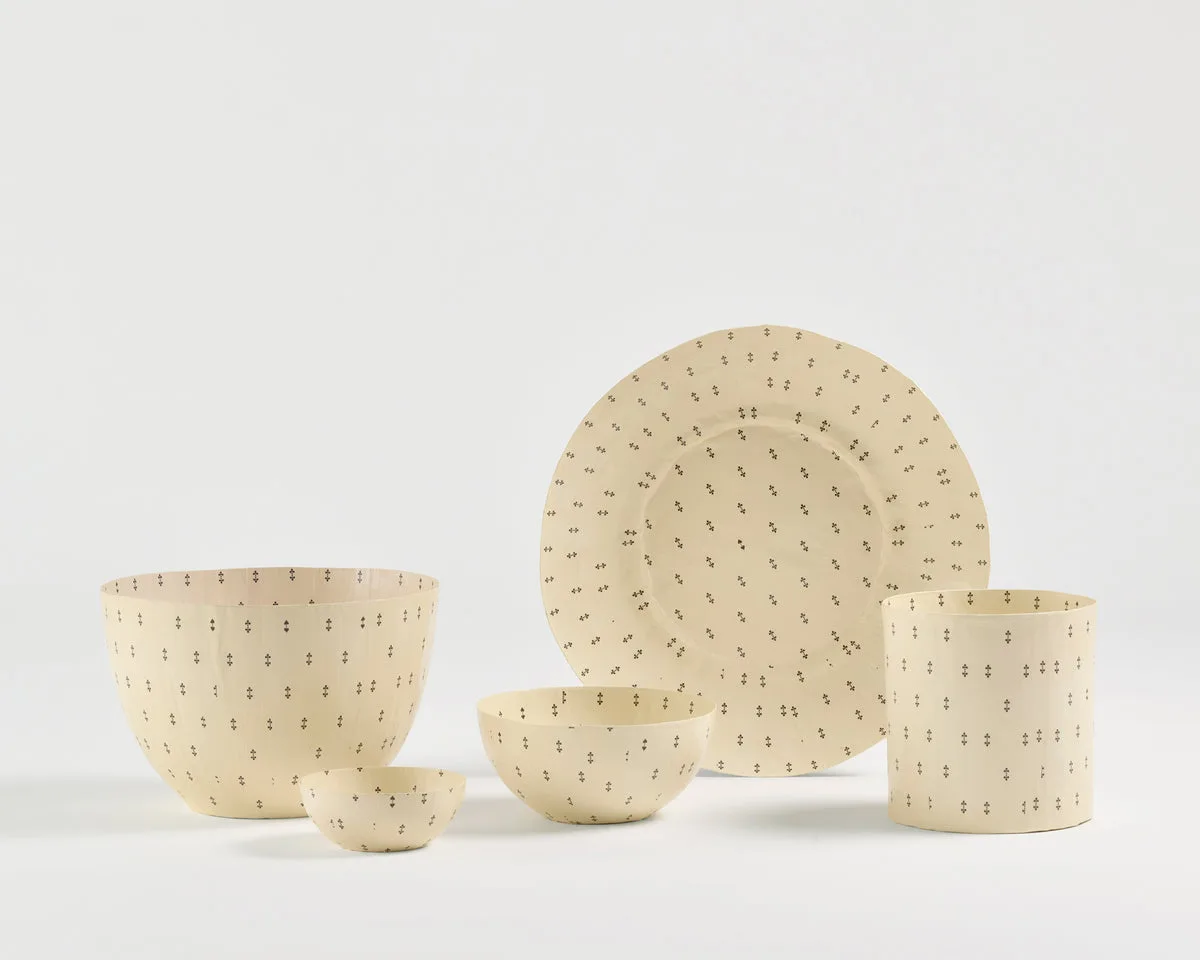 Patterned paper bowls, a plate and a vessel from Pan After’s collection
